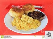 Scrambled eggs sausage and biscuits